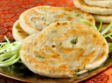 Green onion pancakes are a fried Chinese flatbread eaten as a snack or with a meal.