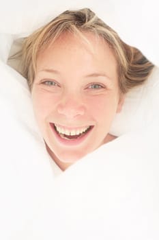 Portrait of a pretty girl in bed