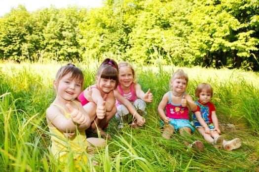 Cute little girls sitting in the park