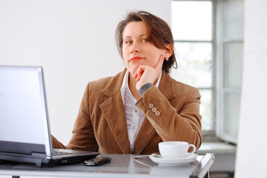 Portraite of a young beautiful business woman executive at work