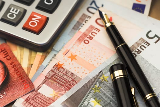 bills,pen and calculator close up