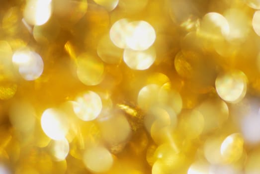 Bright golden abstract background with spherical textures