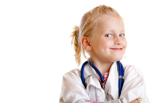Young child is playing doctor with uniform and stethoscope on white background