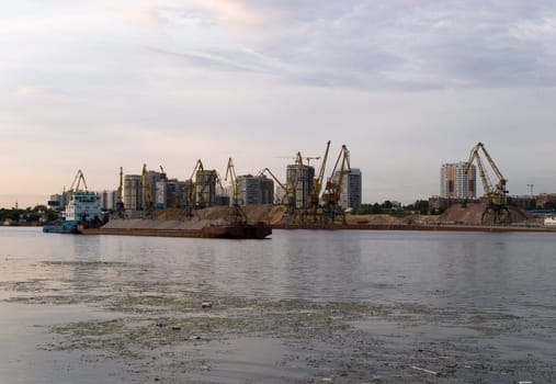The barge at polluted river in Moscow, Russia