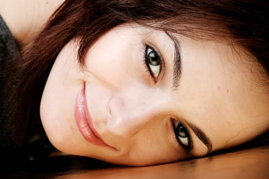 Portrait of a happy beautiful woman with green eyes.