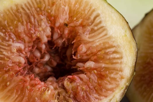 a macro photo of a sliced juicy fig