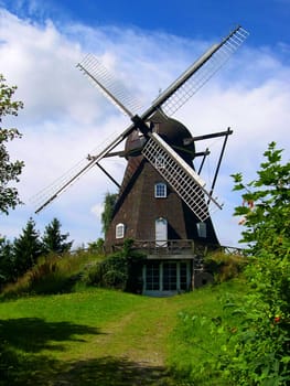 A windmill set in the Danish countryside outside Copenhagen.