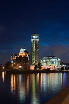 View of the Red Hills Swissotel hotel and Moscow International Hous of Music over the Moskva-river at night