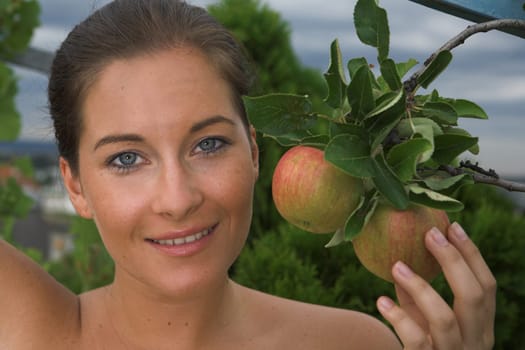 Young attractive Woman with apple in her hand