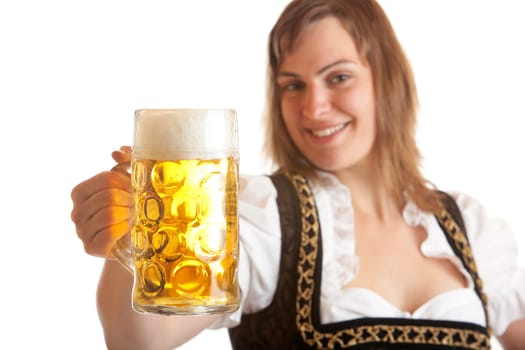 Bavarian woman holds beer stein called "Mass"" in German  into camera"