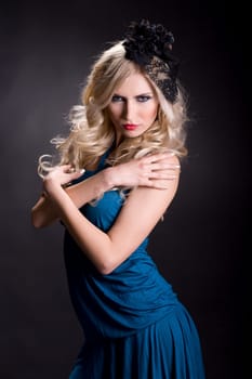Natural beauty posing against black background
