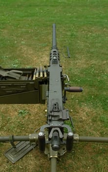heavy military machine gun and ammunition box