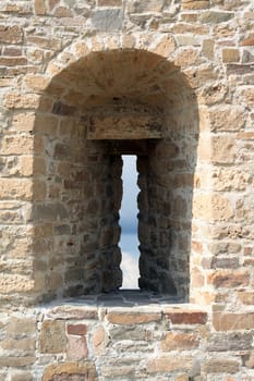 Closeup of ancient fortress wall with embrasure. Object with clipping path