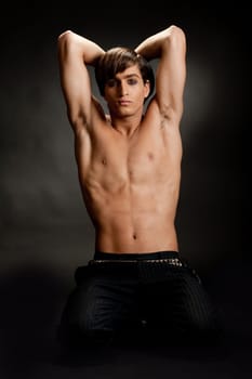 Strong and muscular man posing