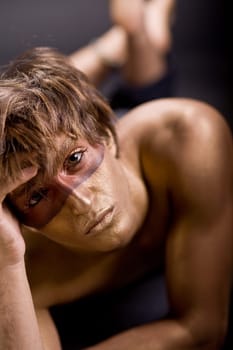 Young man isolated on black background
