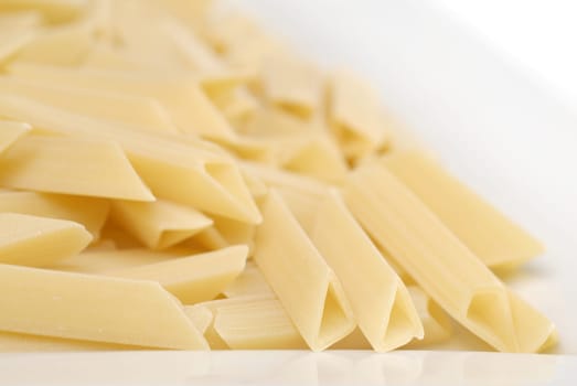 raw macaroni on the white table
