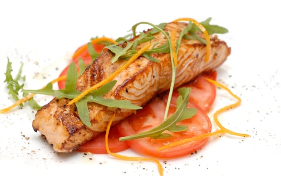 fried fish with tomatto on the wtihe background