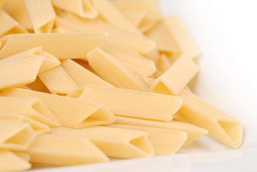 raw macaroni on the white table