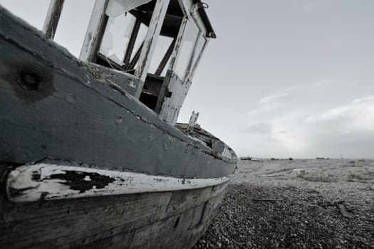 Old boat laying on land