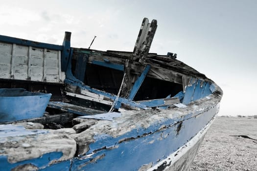 Old boat laying on land