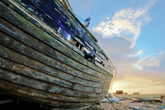 Old boat laying on land