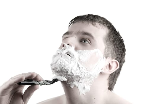 Shaving  Man with razor and foam on white