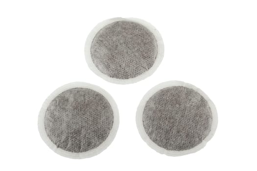 group of three coffee pads isolated on white