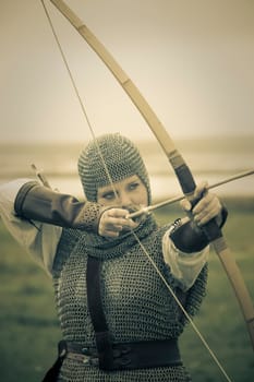 bows woman / medieval armor / historical story  / retro split toned