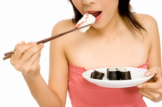 A young asian girls eats am octopus sushi