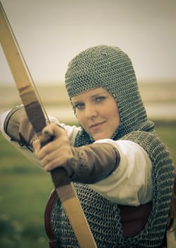 bows woman / medieval armor / historical story  / retro split toned