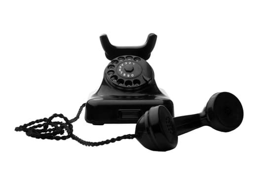 old vintage black rotary telephone isolated on white