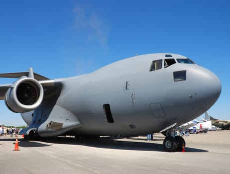 Big and heavy military transport airplane on the ground