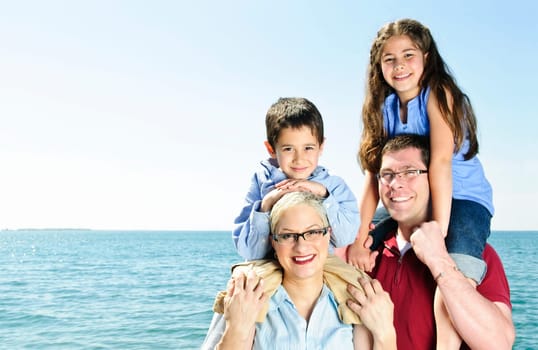 Happy family having fun giving shoulder rides