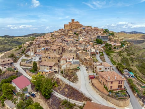 Aerial view of the hilltop medieval village of Ujue in Navarra, northern Spain on ancient pilgrim route Camino de Santiago or Way of St James. Nominated Pretty Town