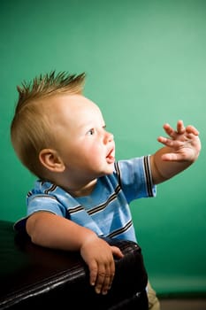 A portrait of a cute nine month old baby boy.