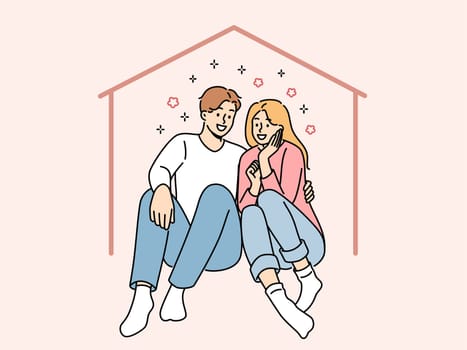 Happy couple sits in imaginary house dreaming of mortgage and buying own property or renting large apartment. Man and woman hugging inside house, using services of real estate insurance