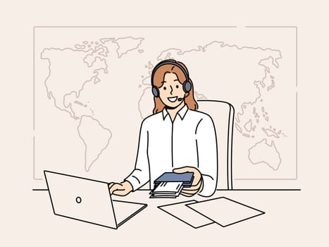Woman manager of travel agency sits at office desk and holds passport with visas and plane tickets. Tour operator company representative in headphones near giant map of world helps to travel