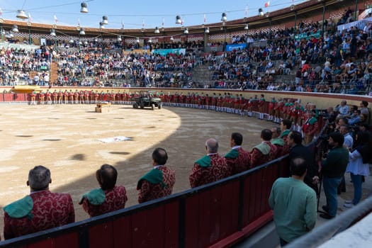 March 26, 2023 Lisbon, Portugal: Tourada - opening of the event - bullfighters stand at the walls of the round arena of the amphitheater. Mid shot