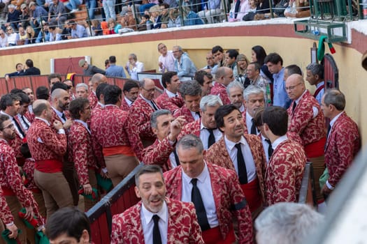 March 26, 2023 Lisbon, Portugal: Tourada - bullfighters in costumes on amphitheater. Mid shot