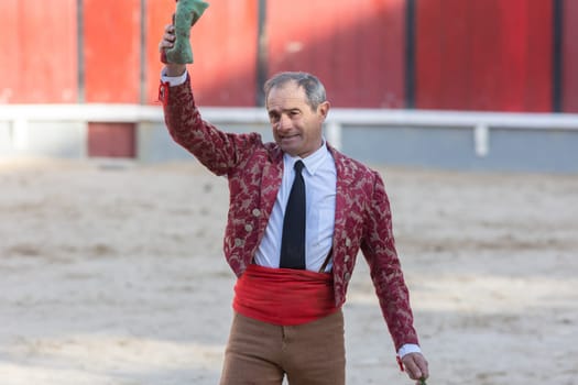 March 26, 2023 Lisbon, Portugal: Tourada - scratched elderly male tereador on the arena. Mid shot