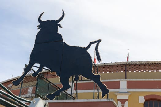 March 26, 2023 Lisbon, Portugal: Tourada - sign of a black bull at the entrance to the arena. Mid shot