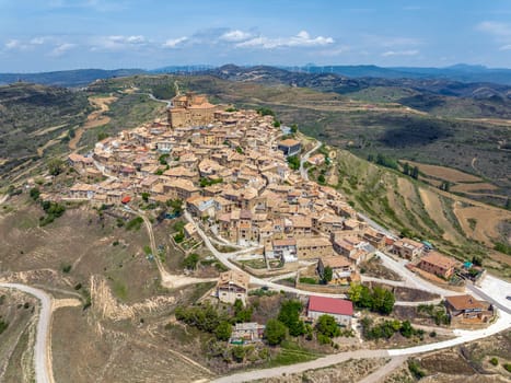 Aerial view of the hilltop medieval village of Ujue in Navarra, northern Spain on ancient pilgrim route Camino de Santiago or Way of St James. Nominated Pretty Town