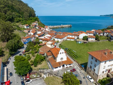 Aerial view Church of Iglesia San Miguel in Tazones Asturias Spain. named beautiful town of Spain