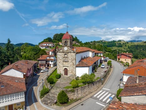 Aerial view of 16th-century San Martín el Real Church in Torazo, Asturias. A serene blend of historic charm and scenic beauty. Nominated Pretty Town