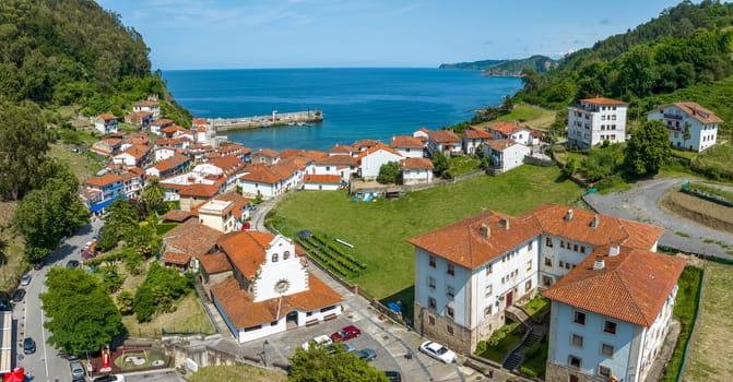 Aerial view panoramic Church of Iglesia San Miguel in Tazones Asturias Spain. named beautiful town of Spain