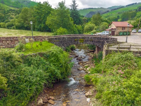 Bridge over the Nansa of Carmona river, Cabuerniga valley, Cantabria in Spain. named beautiful town of Spain