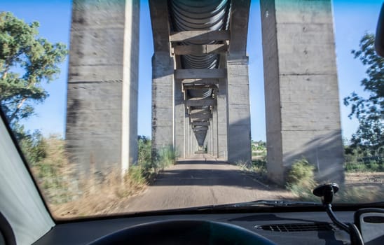 Driving under Acedera Aqueduct. Motion blurred shot
