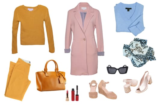 Collage woman clothes. Set of a stylish and trendy women coat, a jeans, boots, a handbag, a cardigan and other accessories isolated on a white background. Fashion trends.