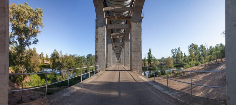 Service road that runs under Acedera Aqueduct. Orellana Irrigation canal, Vegas Altas del Guadiana, Extremadura, Spain