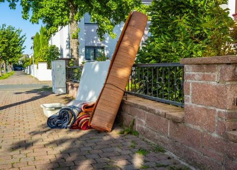 Bulk garbage day concept, miscellaneous rubbish items put on a street for council bulk waste collection, bulky waste and waste management